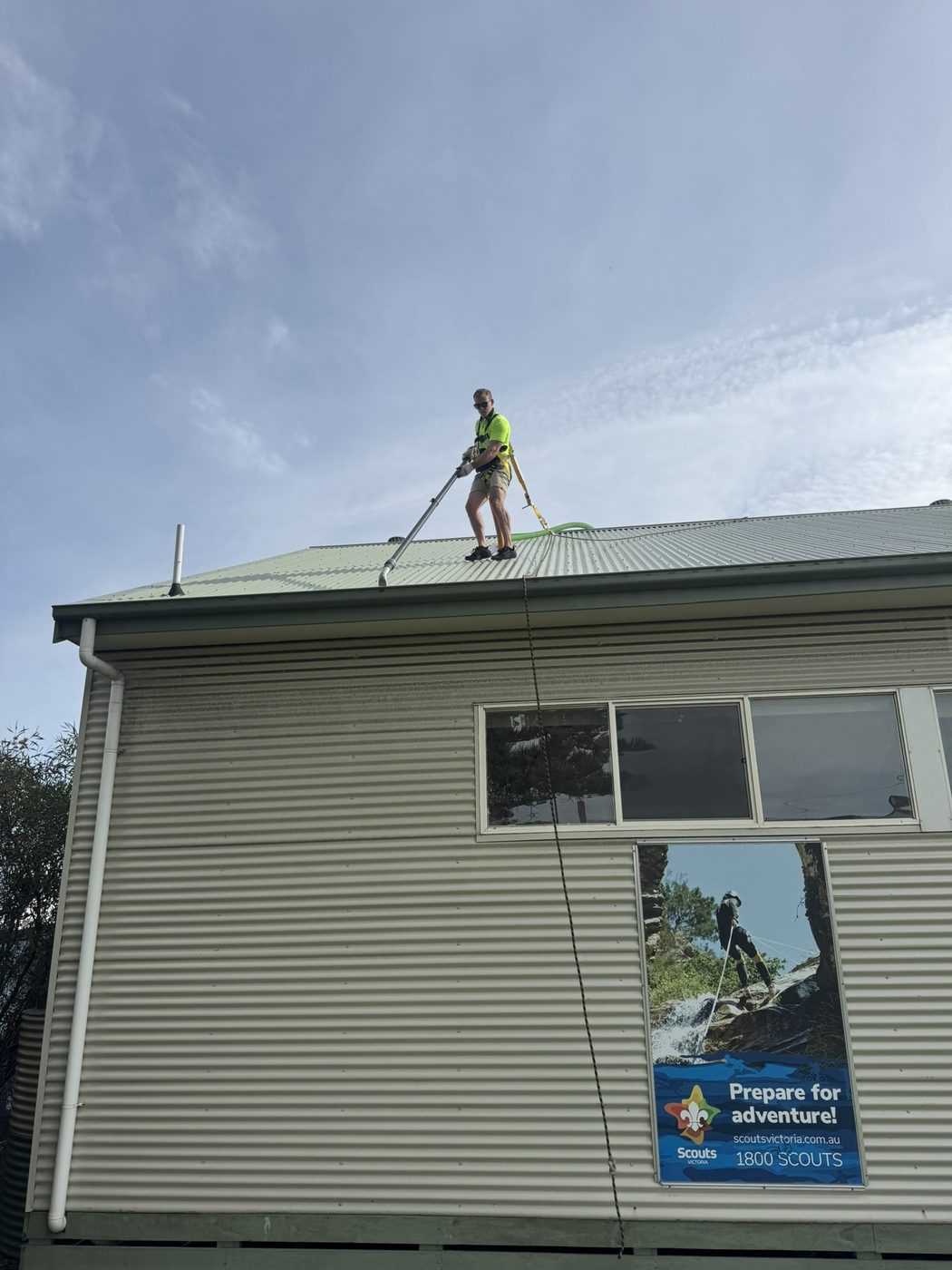Gutter cleaning in progress on a roof